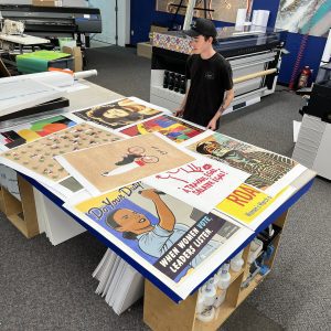 many custom printed posters on tabletop